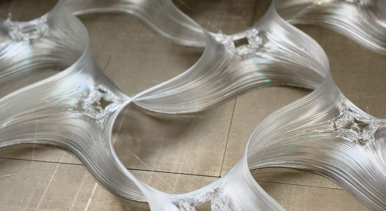 Large-format 3D-printed translucent undulating lattice panels — sculptural forms